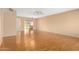 Spacious living room with hardwood floors and access to other rooms at 18001 N 99Th Dr, Sun City, AZ 85373