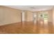 Bright living area with hardwood floors and view into adjacent dining area at 18001 N 99Th Dr, Sun City, AZ 85373