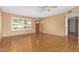 Living room with hardwood floors and access to entry way at 18001 N 99Th Dr, Sun City, AZ 85373
