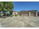 Three-car garage and neutral-toned exterior at 1820 W Magdalena Ln, Phoenix, AZ 85041