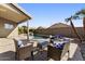 Peaceful patio with wicker furniture and a view of the pool at 2035 S 86Th Ln, Tolleson, AZ 85353