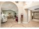 Bright and spacious entryway with high ceilings and tile flooring at 21015 N Desert Sands Dr, Sun City West, AZ 85375