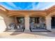 Covered patio with comfortable seating and desert landscaping at 21015 N Desert Sands Dr, Sun City West, AZ 85375