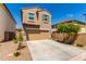 Two-story home with attached garage and landscaped front yard at 2222 S Deerfield Ln, Gilbert, AZ 85295