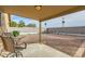 Covered patio overlooking a gravel backyard with fire pit at 25763 W Satellite Ln, Buckeye, AZ 85326