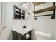 Clean bathroom with updated vanity, fixtures, and floating shelves at 25763 W Satellite Ln, Buckeye, AZ 85326