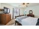 Well-lit bedroom with carpeted flooring and ceiling fan at 25763 W Satellite Ln, Buckeye, AZ 85326