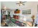 Dining room with glass table and chairs, adjacent to the kitchen at 25763 W Satellite Ln, Buckeye, AZ 85326