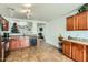 Bright kitchen features ample cabinetry, tile flooring, and stainless steel appliances at 25763 W Satellite Ln, Buckeye, AZ 85326