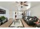 Open living room with a view into the kitchen and a Christmas tree at 25763 W Satellite Ln, Buckeye, AZ 85326