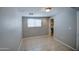 Bedroom with bathroom access and tile floors at 3530 N 63Rd Dr, Phoenix, AZ 85033