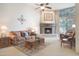 Living room with corner fireplace, comfortable seating, and southwestern decor at 39002 N Habitat Cir, Cave Creek, AZ 85331