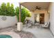 Covered patio with seating area and access to kitchen at 39002 N Habitat Cir, Cave Creek, AZ 85331