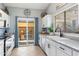 Modern kitchen with white cabinets, stainless steel appliances, and granite countertops at 5016 W Kristal Way, Glendale, AZ 85308