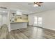 Kitchen with gray cabinets, an island, and wood-look flooring at 6746 W Holly St, Phoenix, AZ 85035