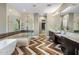 Elegant bathroom with a soaking tub, walk-in shower, and double vanity at 7262 E Lower Wash Pass, Scottsdale, AZ 85266