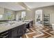Elegant bathroom with double vanity and herringbone tile floor at 7262 E Lower Wash Pass, Scottsdale, AZ 85266