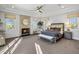 Spacious main bedroom with a fireplace and plenty of natural light at 7262 E Lower Wash Pass, Scottsdale, AZ 85266