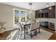 Bright breakfast nook with a table for four and access to a private backyard at 7262 E Lower Wash Pass, Scottsdale, AZ 85266