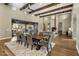 Open concept dining area with a large table, seating, and views into the living room and backyard at 7262 E Lower Wash Pass, Scottsdale, AZ 85266