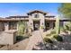 Stunning exterior of a Spanish-style home with a welcoming walkway at 7262 E Lower Wash Pass, Scottsdale, AZ 85266