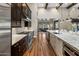 Modern kitchen boasts dark cabinetry, stainless steel appliances, and granite countertops at 7262 E Lower Wash Pass, Scottsdale, AZ 85266