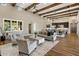 Open living area with high ceilings, hardwood floors, and a cozy fireplace at 7262 E Lower Wash Pass, Scottsdale, AZ 85266