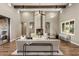 Spacious living room with high ceilings, hardwood floors, and a large fireplace at 7262 E Lower Wash Pass, Scottsdale, AZ 85266