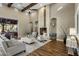 Open living area with high ceilings, hardwood floors, and a large fireplace at 7262 E Lower Wash Pass, Scottsdale, AZ 85266