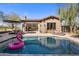 Stunning pool with a flamingo float and plenty of room for relaxation at 7262 E Lower Wash Pass, Scottsdale, AZ 85266