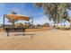 Community playground with shaded play area and bench at 8926 W Christopher Michael Ln, Peoria, AZ 85345