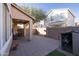 Covered patio with tile flooring and a small sitting area at 964 E Ranch Rd, Gilbert, AZ 85296