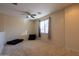 Upstairs bedroom with a ceiling fan and neutral decor at 964 E Ranch Rd, Gilbert, AZ 85296