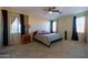 Bright bedroom with double bed, window, and dresser at 964 E Ranch Rd, Gilbert, AZ 85296