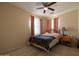 Bedroom with queen-size bed and window at 964 E Ranch Rd, Gilbert, AZ 85296