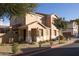 Two-story tan house with a garage and landscaping at 964 E Ranch Rd, Gilbert, AZ 85296