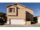 Two-story tan house with a white garage door at 964 E Ranch Rd, Gilbert, AZ 85296