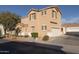 Two-story tan house with a garage and landscaping at 964 E Ranch Rd, Gilbert, AZ 85296