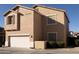 Tan two-story house with attached garage, and landscaping at 964 E Ranch Rd, Gilbert, AZ 85296