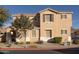 Two-story tan house with a garage and landscaping at 964 E Ranch Rd, Gilbert, AZ 85296
