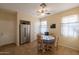 Kitchen with stainless steel appliances, breakfast table, and ample cabinet space at 964 E Ranch Rd, Gilbert, AZ 85296