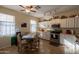 Kitchen with white cabinets, stainless steel appliances and a breakfast table at 964 E Ranch Rd, Gilbert, AZ 85296