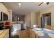 Modern kitchen with white cabinets, stainless steel appliances, and breakfast area at 964 E Ranch Rd, Gilbert, AZ 85296