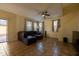 Living room with a brown sectional sofa and tile floors at 964 E Ranch Rd, Gilbert, AZ 85296