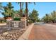 Landscaped entrance to the community with brick pavement and signage at 9711 E Mountain View Rd # 1516, Scottsdale, AZ 85258