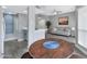 Dining area with round wooden table and gray tile floor at 9711 E Mountain View Rd # 1516, Scottsdale, AZ 85258