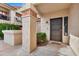 Condo entry with security door and well-maintained landscaping at 9711 E Mountain View Rd # 1516, Scottsdale, AZ 85258
