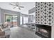 Open floor plan with living room, kitchen, and fireplace at 9711 E Mountain View Rd # 1516, Scottsdale, AZ 85258