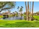 Community pond with fountain and lush landscaping at 9711 E Mountain View Rd # 1516, Scottsdale, AZ 85258