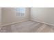 Simple bedroom with neutral carpeting and window with blinds at 10359 N 115Th Ave, Youngtown, AZ 85363
